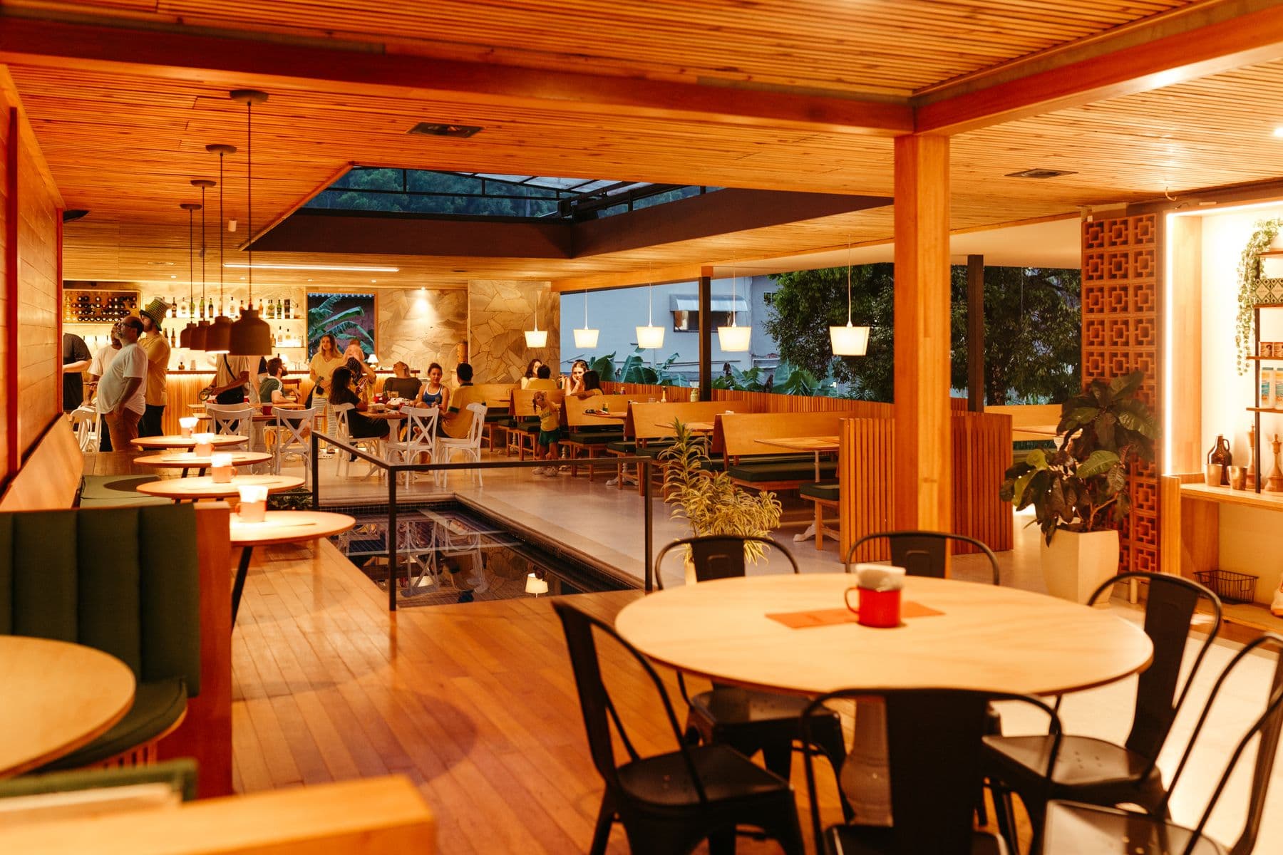 Warm commercial interior with a timber ceiling and carefully finished seating areas